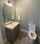 Additional Half Bathroom for guest to use when wet located by Ping Pong Table 